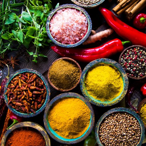 Variety of spices and herbs on kitchen table